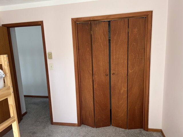 interior details with carpet flooring and baseboards