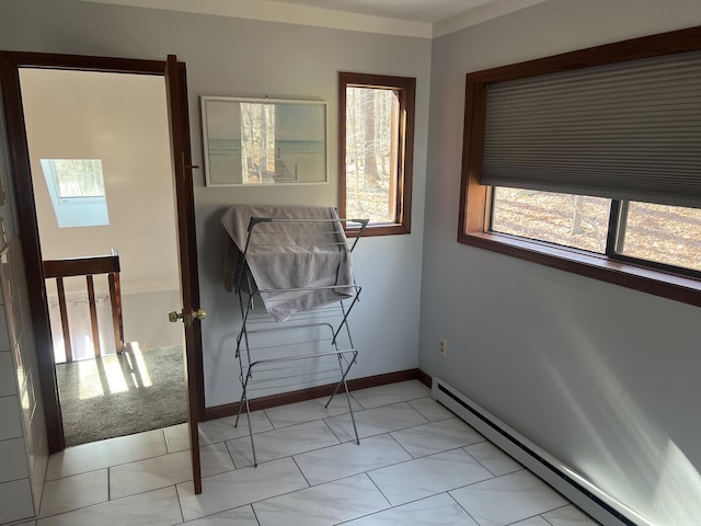 spare room featuring baseboards and baseboard heating