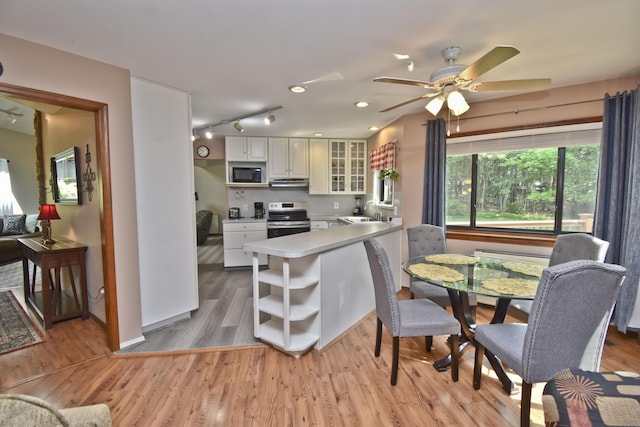 122 Mcmichaels Ct, Stroudsburg, PA 18360 - kitchen featuring black microwave, stainless steel range with electric stovetop, open shelves, under cabinet range hood, and glass insert cabinets