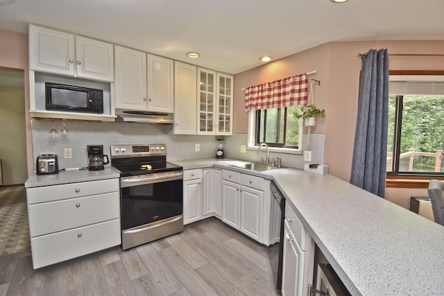 122 Mcmichaels Ct, Stroudsburg, PA 18360 - kitchen featuring stainless steel range with electric stovetop, black microwave, under cabinet range hood, light countertops, and dishwashing machine