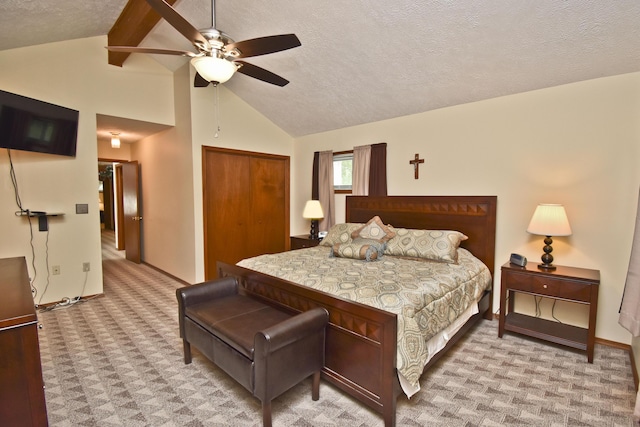 122 Mcmichaels Ct, Stroudsburg, PA 18360 - bedroom with light colored carpet, a closet, high vaulted ceiling, a textured ceiling, and beamed ceiling