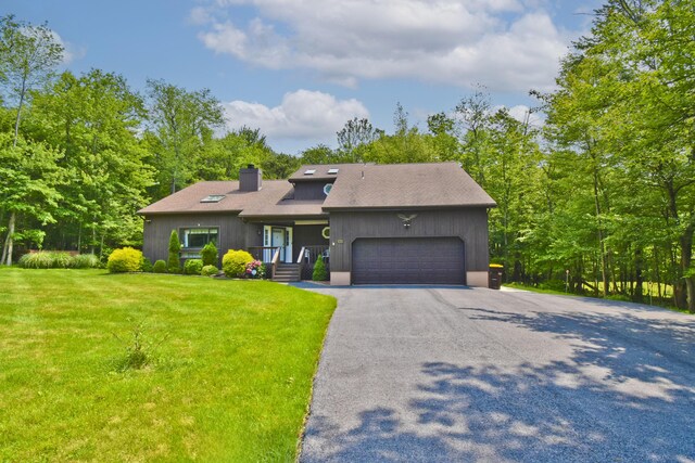 122 Mcmichaels Ct, Stroudsburg, PA 18360 - mid-century inspired home with a chimney, a garage, asphalt driveway, and a front yard