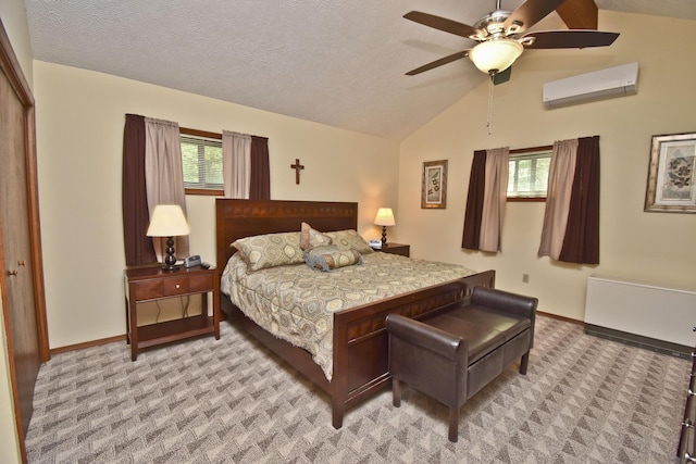 122 Mcmichaels Ct, Stroudsburg, PA 18360 - bedroom with a wall mounted air conditioner, vaulted ceiling, multiple windows, light carpet, and a textured ceiling