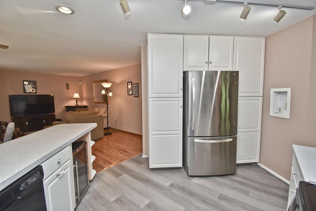 122 Mcmichaels Ct, Stroudsburg, PA 18360 - kitchen featuring freestanding refrigerator, black dishwasher, white cabinetry, and light wood-type flooring