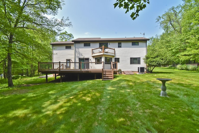 122 Mcmichaels Ct, Stroudsburg, PA 18360 - back of property with a balcony, a wooden deck, and a yard