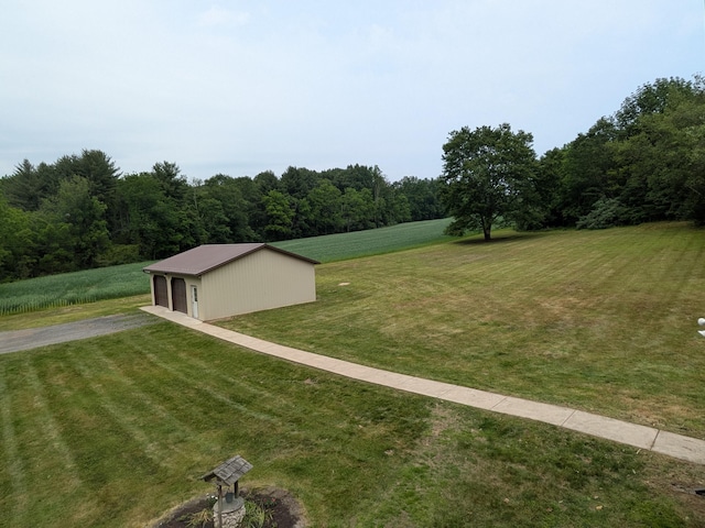 124 Sterling Valley Rd, Kunkletown, PA 18058 - view of green lawn featuring an outbuilding, a pole building, a garage, and a forest view