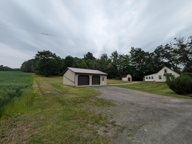 124 Sterling Valley Rd, Kunkletown, PA 18058 - view of green lawn featuring a garage and a storage shed