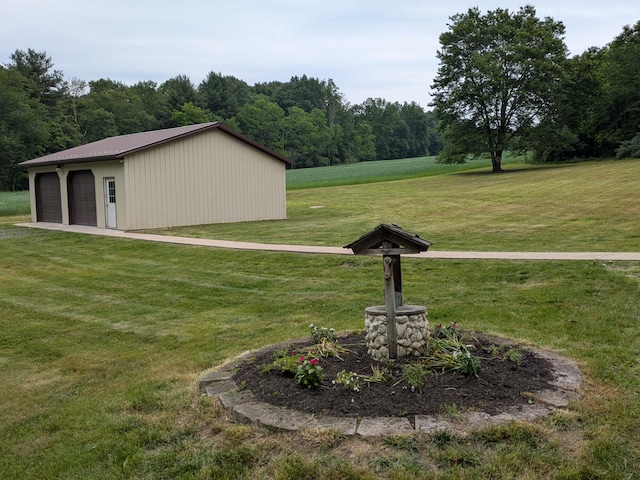 124 Sterling Valley Rd, Kunkletown, PA 18058 - view of grassy yard with an outdoor structure, a detached garage, and a forest view
