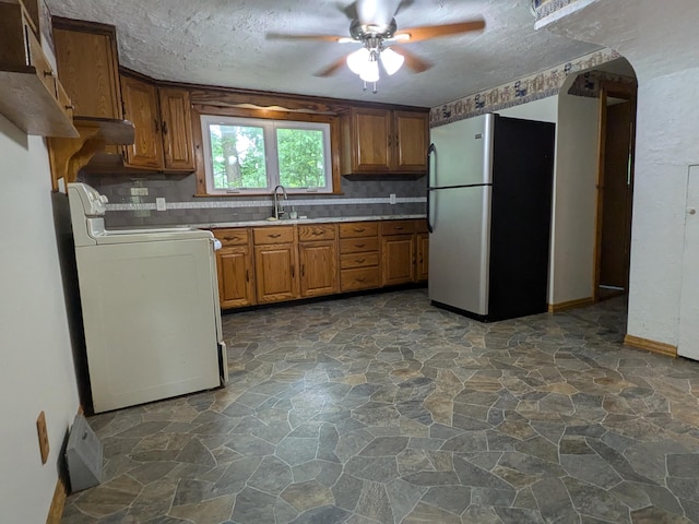 124 Sterling Valley Rd, Kunkletown, PA 18058 - kitchen featuring freestanding refrigerator, stove, stone flooring, a ceiling fan, and brown cabinets