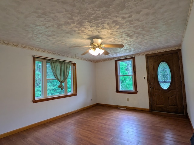 124 Sterling Valley Rd, Kunkletown, PA 18058 - foyer entrance with wood finished floors, a ceiling fan, and a textured ceiling
