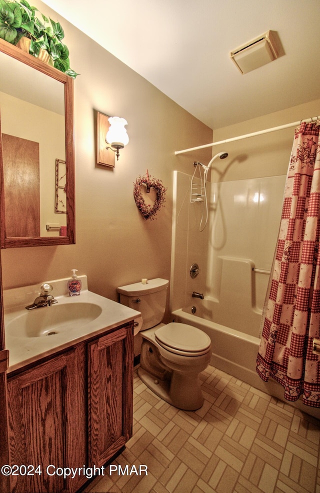 full bathroom featuring toilet, visible vents, shower / bath combo with shower curtain, and vanity