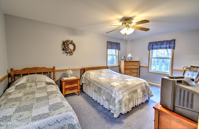 bedroom with carpet, a baseboard radiator, and a ceiling fan