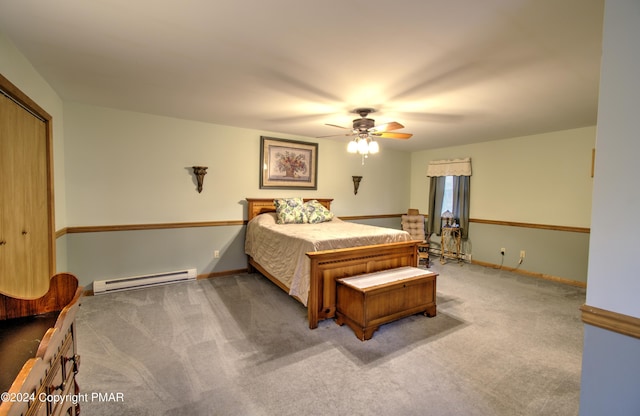 carpeted bedroom with baseboard heating, a ceiling fan, and baseboards