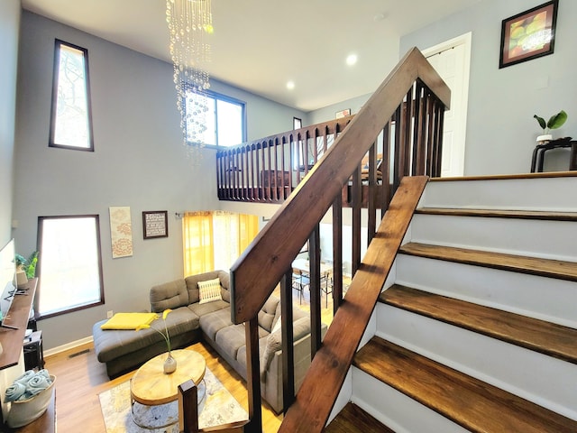 8237 Natures Dr, Tobyhanna, PA 18466 - stairs with visible vents, wood finished floors, recessed lighting, baseboards, and a chandelier