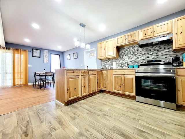 kitchen featuring under cabinet range hood, stainless steel electric stove, a peninsula, and light brown cabinetry