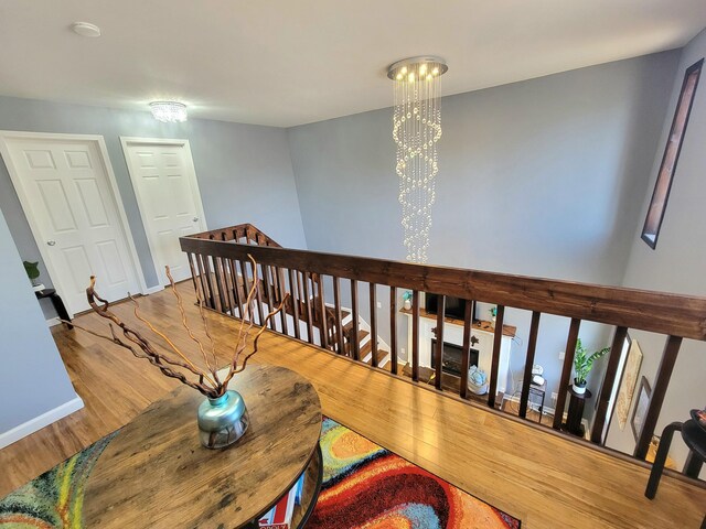 8237 Natures Dr, Tobyhanna, PA 18466 - dining area featuring an inviting chandelier, wood finished floors, and baseboards
