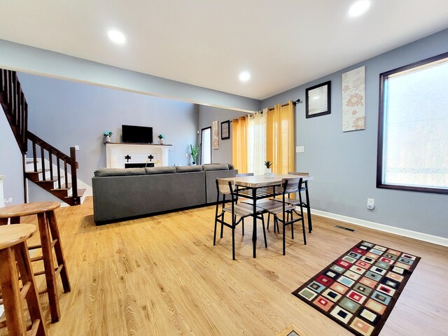 8237 Natures Dr, Tobyhanna, PA 18466 - dining area with visible vents, recessed lighting, light wood-style floors, baseboards, and stairs