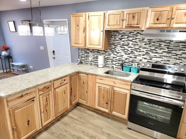 8237 Natures Dr, Tobyhanna, PA 18466 - kitchen featuring light brown cabinets, under cabinet range hood, a peninsula, electric stove, and a sink
