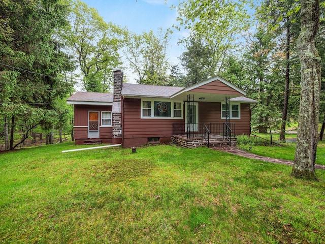 505 Moseywood Rd, Lake Harmony, PA 18624 - view of front of house featuring a chimney and a front yard