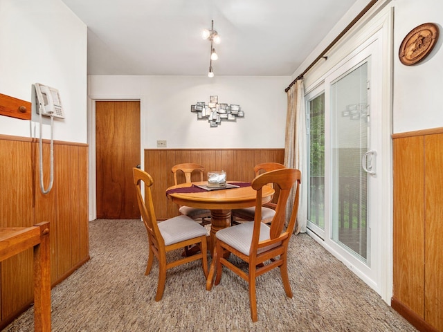 505 Moseywood Rd, Lake Harmony, PA 18624 - carpeted dining room with a wainscoted wall and wood walls