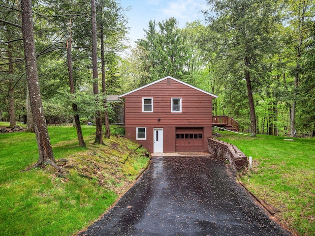 505 Moseywood Rd, Lake Harmony, PA 18624 - view of front of house featuring driveway, a front lawn, an attached garage, and a deck