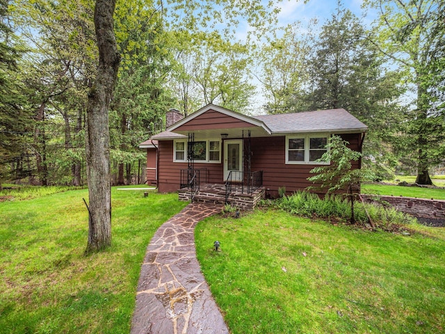 505 Moseywood Rd, Lake Harmony, PA 18624 - view of front of house with a chimney, a front lawn, and a porch