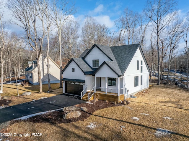 view of front of house with a garage and covered porch