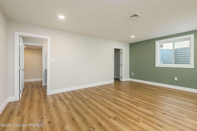 unfurnished bedroom featuring light wood-type flooring