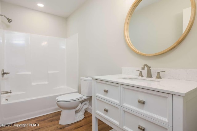 full bathroom featuring shower / tub combination, wood-type flooring, toilet, and vanity