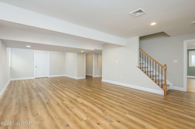 basement featuring light wood-type flooring