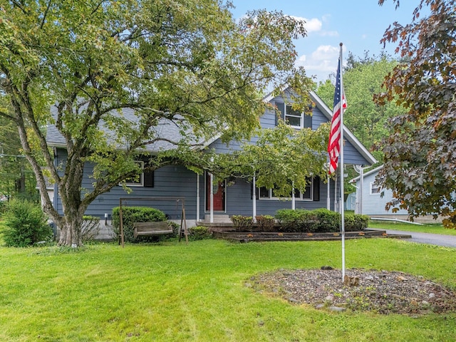 596 Chestnut St, East Stroudsburg, PA 18301 - view of property hidden behind natural elements featuring a front yard and a porch
