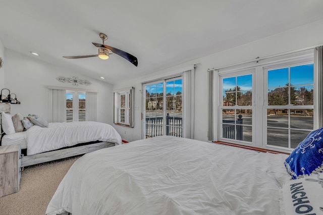 bedroom with lofted ceiling, ceiling fan, carpet floors, and access to exterior