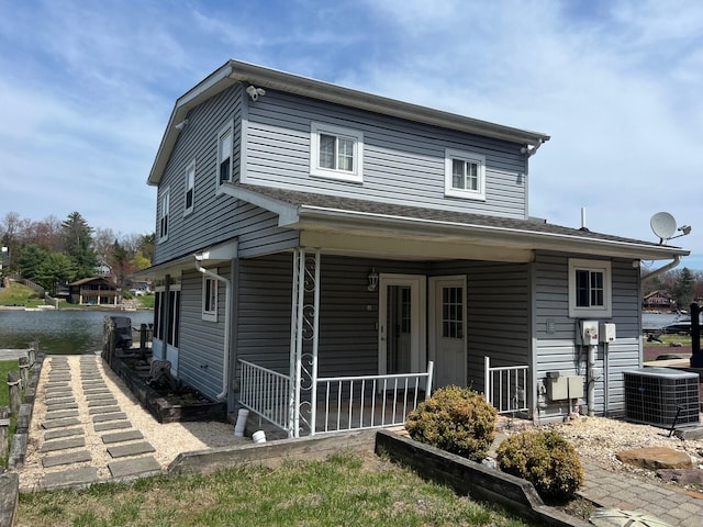 92 S Lake Dr, Lake Harmony, PA 18624 - rear view of house featuring central AC unit, a water view, and a porch