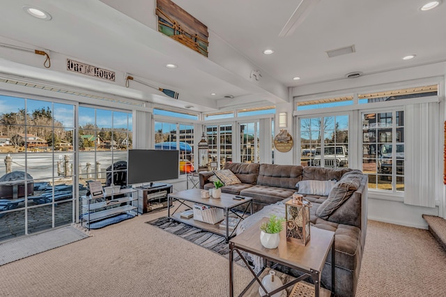 carpeted living room with recessed lighting