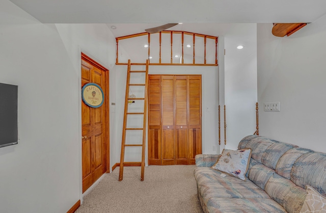 living room with recessed lighting and light colored carpet