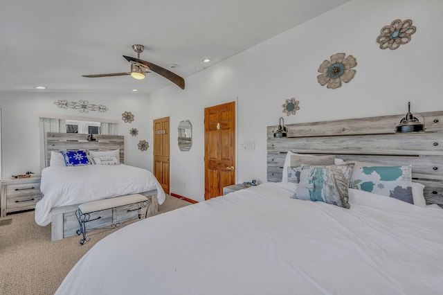 carpeted bedroom with vaulted ceiling, a ceiling fan, and recessed lighting