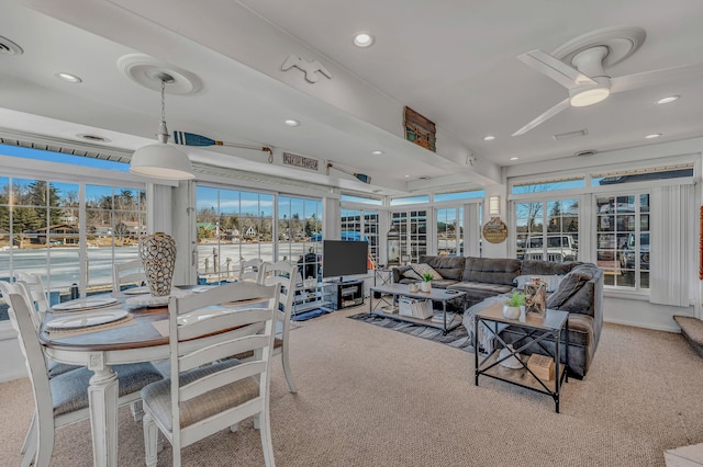 carpeted living area featuring ceiling fan, visible vents, and recessed lighting