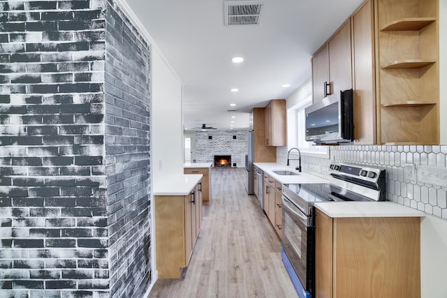 171 Knob Rd, Mount Pocono, PA 18344 - kitchen featuring a sink, open shelves, light wood-type flooring, visible vents, and appliances with stainless steel finishes