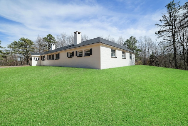 171 Knob Rd, Mount Pocono, PA 18344 - rear view of house with a yard, brick siding, and a chimney