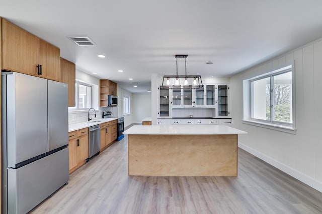 171 Knob Rd, Mount Pocono, PA 18344 - kitchen with light wood-style flooring, visible vents, a sink, open shelves, and stainless steel appliances