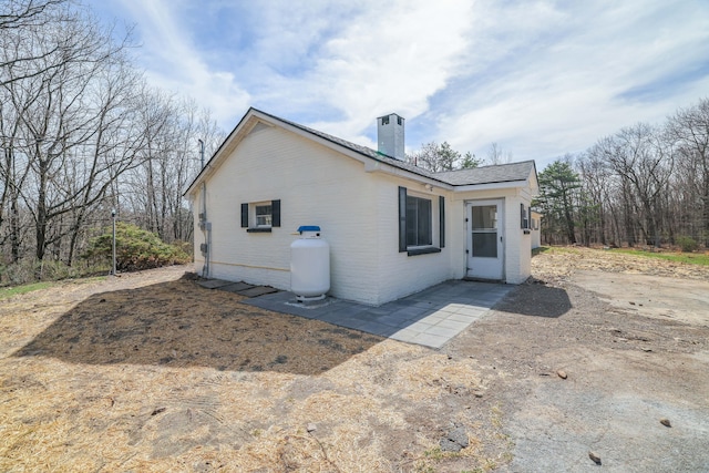 171 Knob Rd, Mount Pocono, PA 18344 - view of side of property featuring brick siding and a chimney