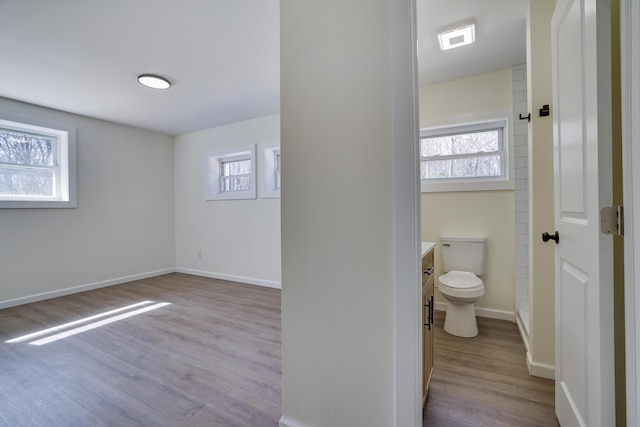 171 Knob Rd, Mount Pocono, PA 18344 - bathroom with toilet, baseboards, a healthy amount of sunlight, and wood finished floors