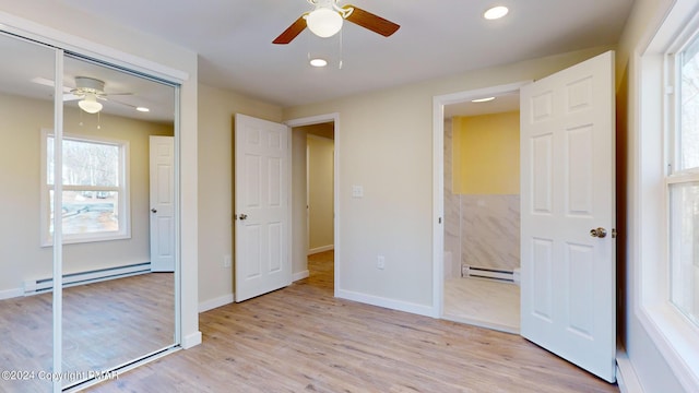 unfurnished bedroom with light wood-style floors, recessed lighting, baseboards, and baseboard heating