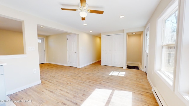 unfurnished room featuring light wood-style floors, recessed lighting, ceiling fan, and baseboards