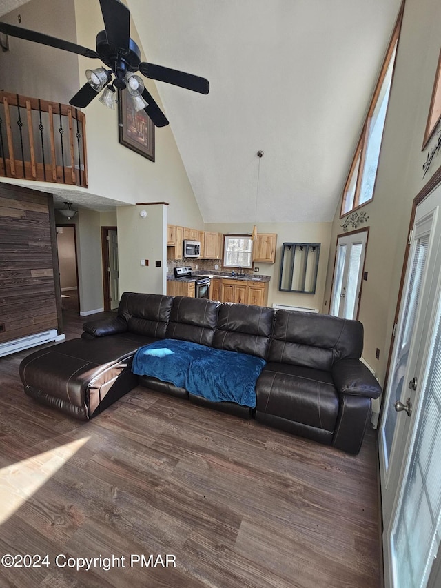 living room featuring high vaulted ceiling, wood finished floors, and a ceiling fan