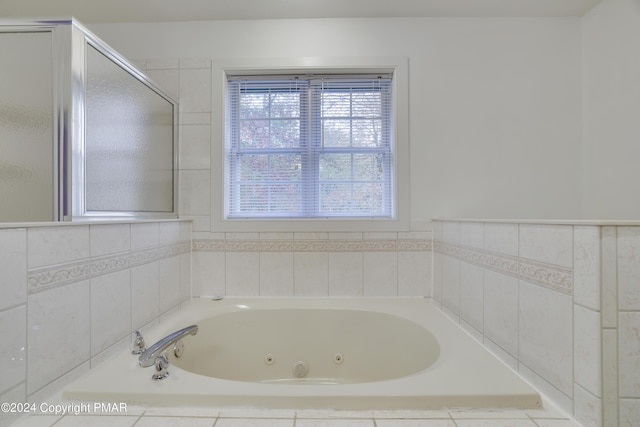 bathroom with a jetted tub