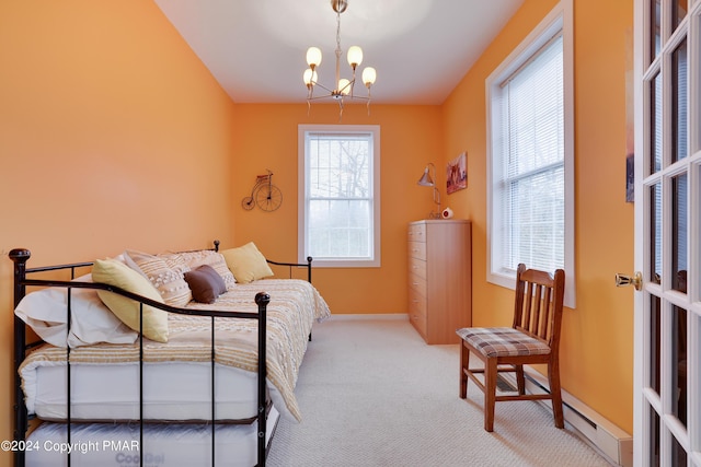 carpeted bedroom with baseboards and a notable chandelier