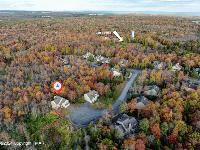 drone / aerial view with a view of trees