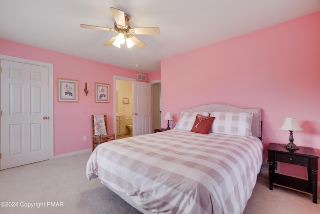 bedroom with light carpet, baseboards, visible vents, connected bathroom, and ceiling fan