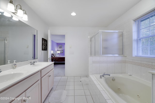 bathroom featuring a stall shower, tile patterned flooring, a sink, and a tub with jets